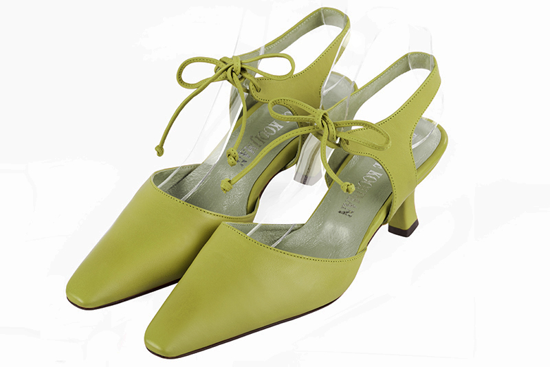 Pistachio green women's open back shoes, with an instep strap. Tapered toe. Medium spool heels. Front view - Florence KOOIJMAN